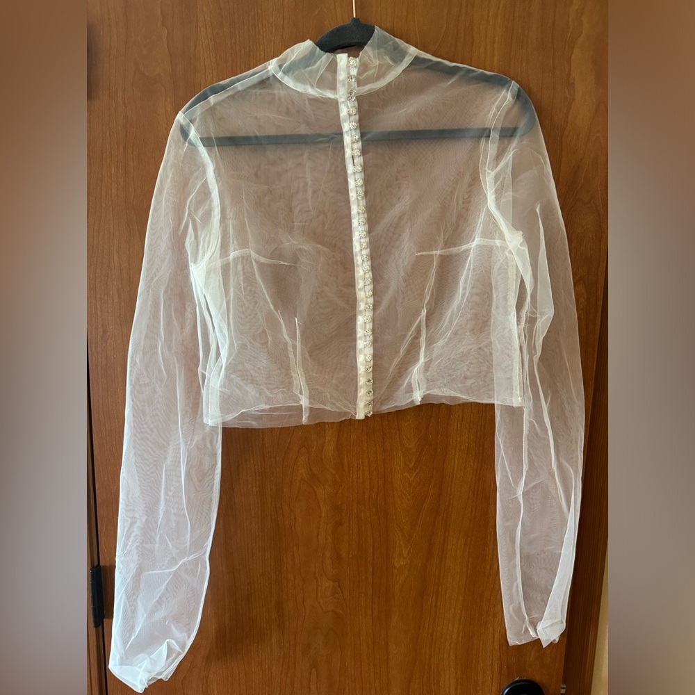 White sheer blouse with rhinestone buttons down the back.
